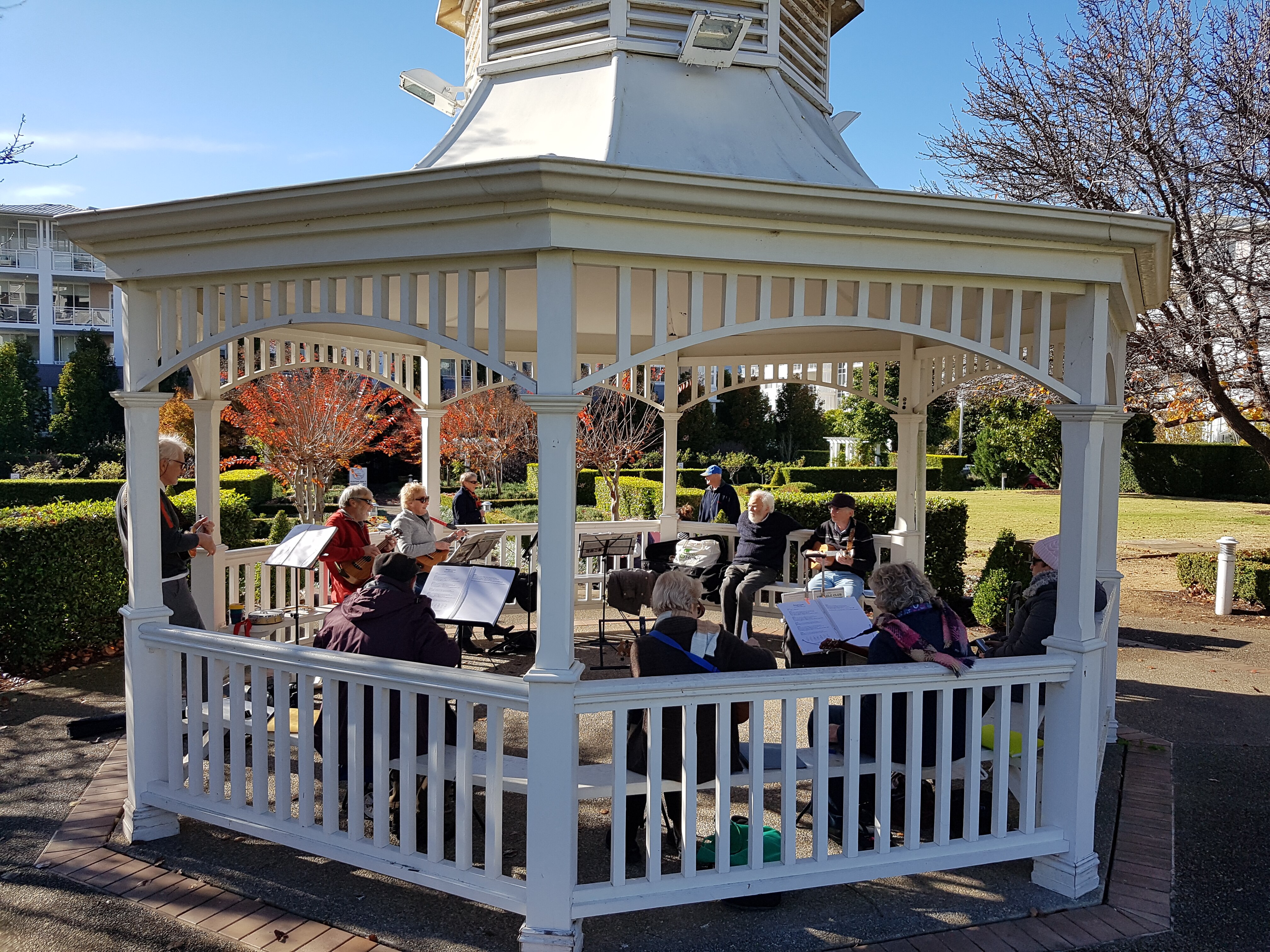 Breakfast Point Uke Group rehearsing in a rotunda