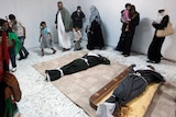 Libyans view Gaddafi's corpse