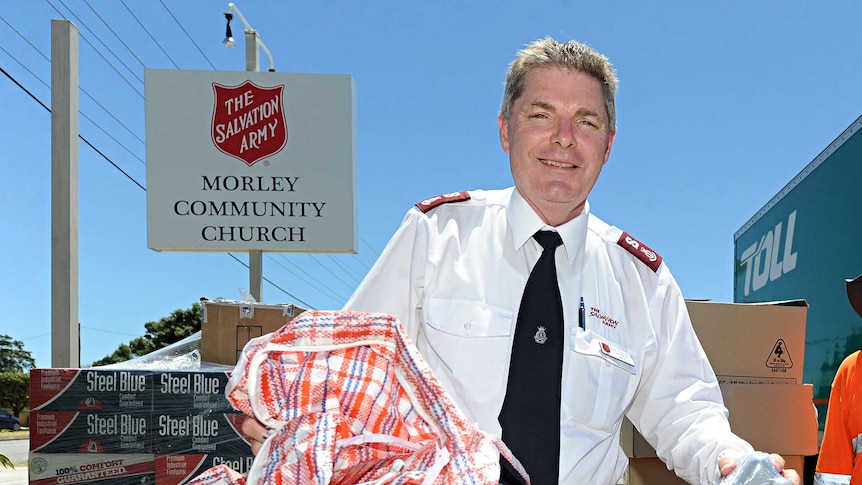 Geoff Freind with donated goods outside The Salvation Army's Morley Community Church.