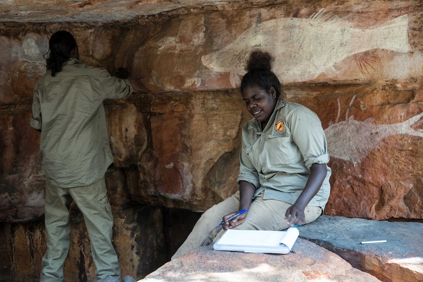 Female rangers catalogue newly uncovered rock art in Arnhem Land.