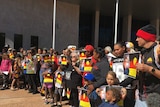 A group of protestors standing outside the Alice Springs Supreme Court.