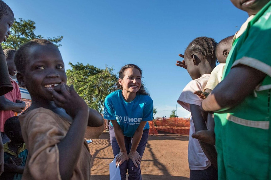 Actress and humanitarian Kristin Davis with refugee children.