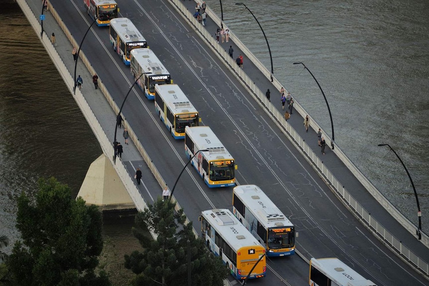 Buses lined up in lane at peak hour on Victoria Bridge in Brisbane's CBD