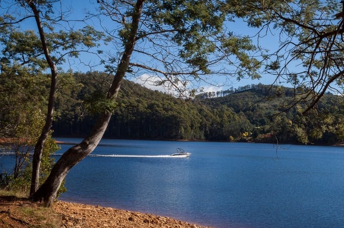 A lake with hills behind.