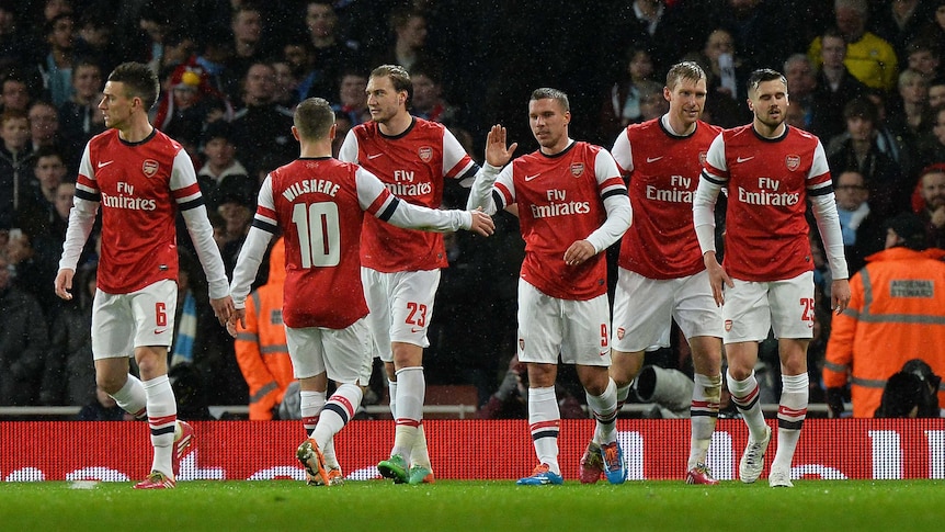 Arsenal celebrates Podolski double against Coventry