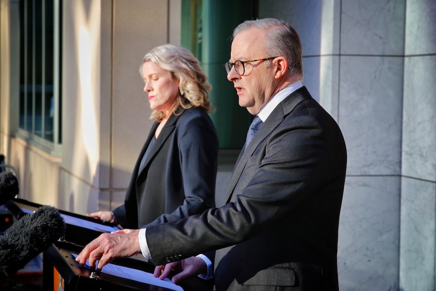 Albanese and O'Neil stand in the prime minister's courtyard at parliament house.