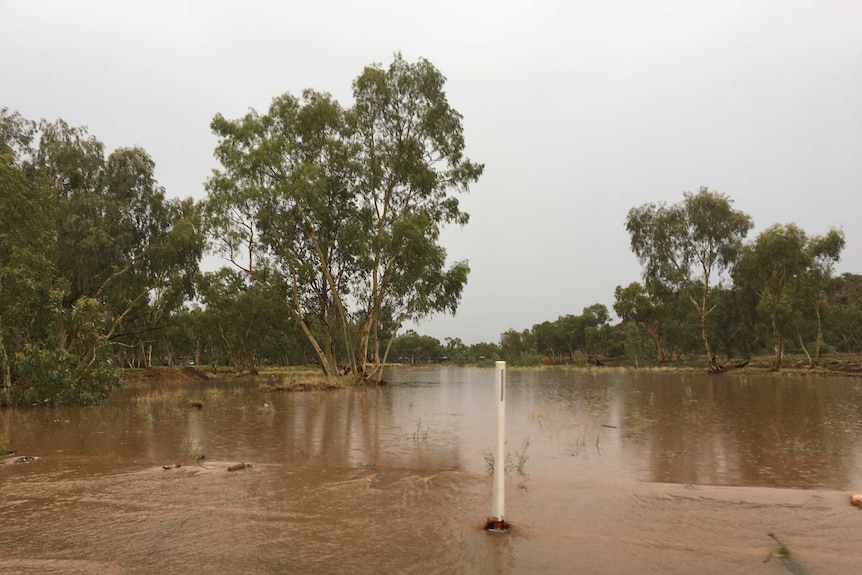 murky water over road grey skies