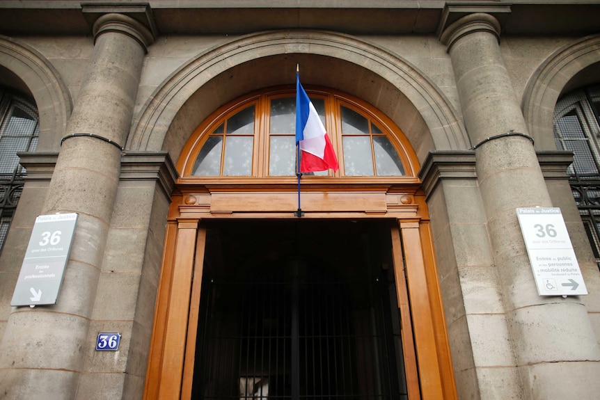 A stone doorway marked with a French flag an the number 36