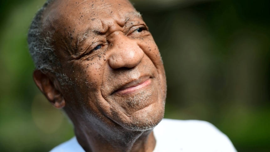 Bill Cosby's face as he looks to the side. 