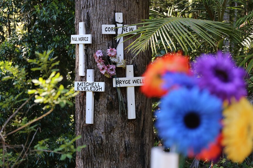Flowers and crosses at roadside memorial