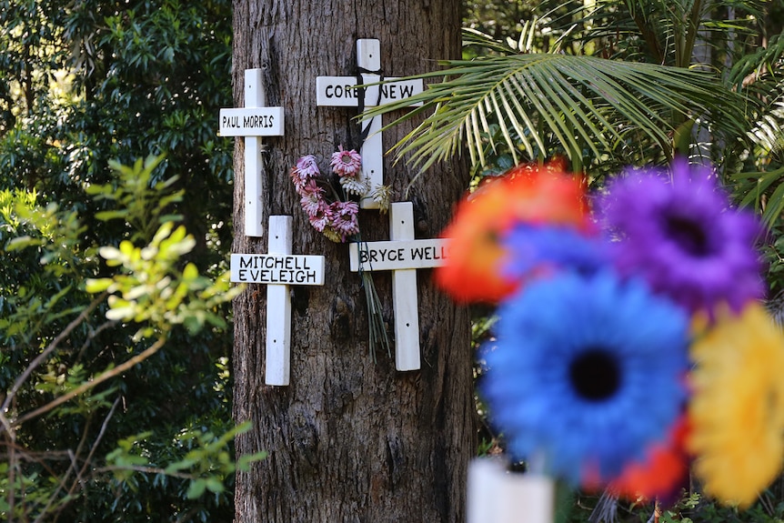 Flowers and crosses at roadside memorial