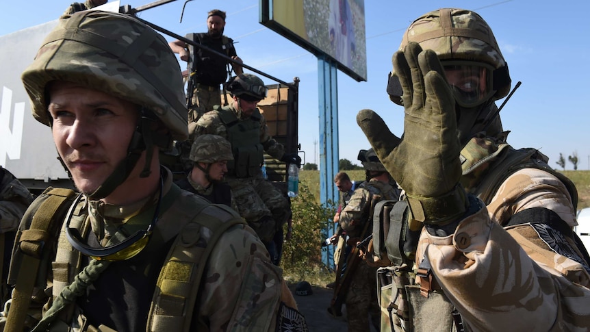 Ukrainian soldiers gather in Mariupol