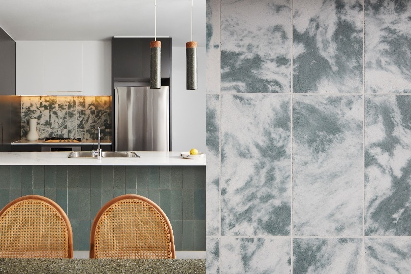 A composite image of a kitchen and close up of blue and white tiles