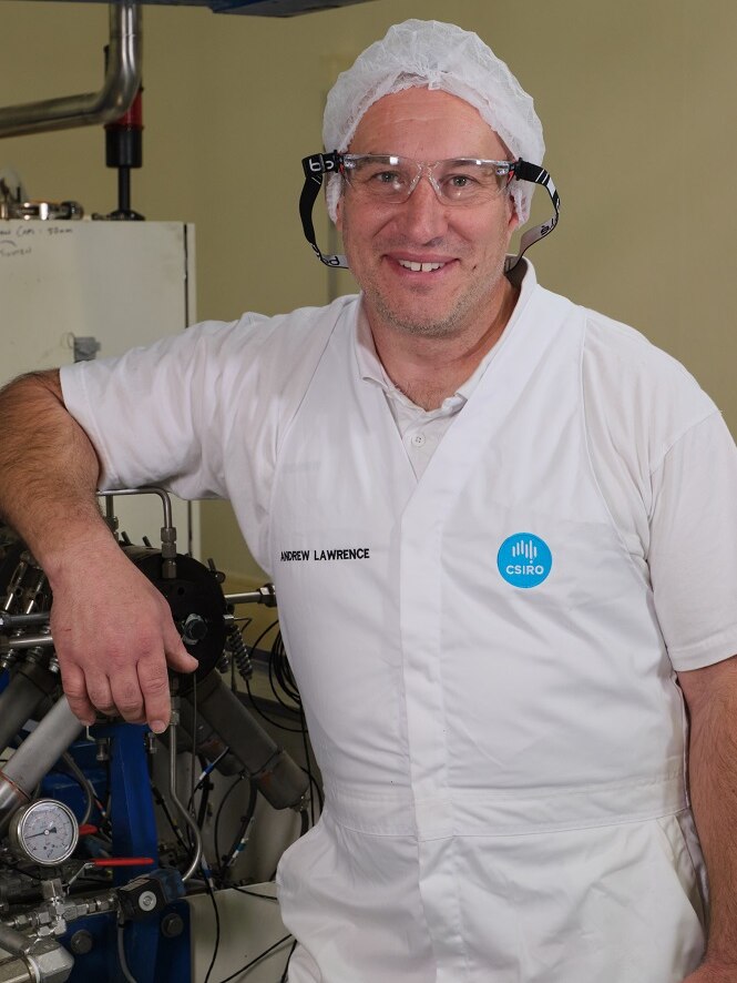 CSIRO scientist standing with the equipment