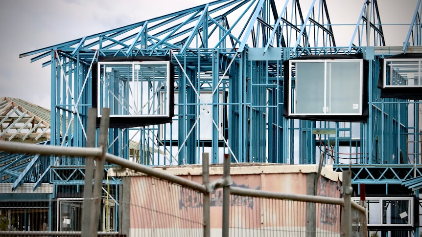 The frame of a house under construction.