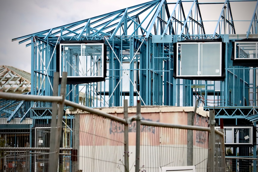 The frame of a house under construction.