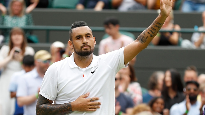 Nick Kyrgios waves to the spectators after losing his match