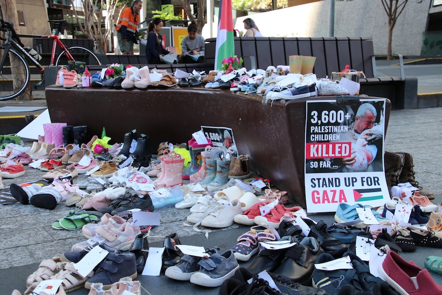 A display of children's shoes at a rally