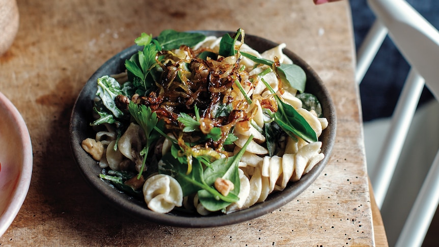 Caramelised onion cashew cream with spiral pasta and greens.