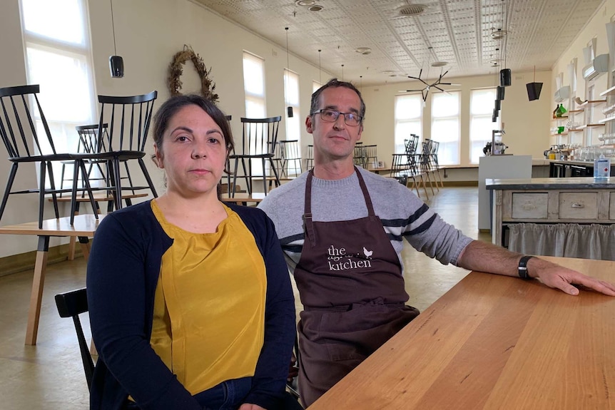 Severine Demanet and Rodney Dunn in empty restaurant.