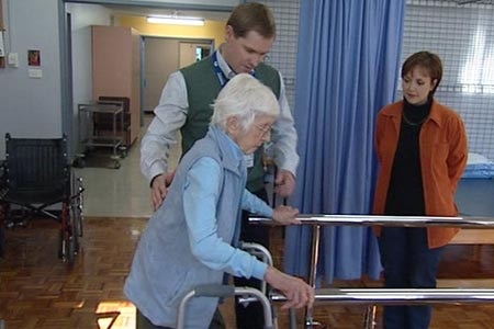 elderly woman in rehabilitation with doctor