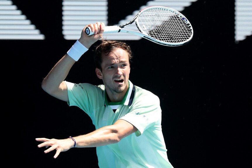 Daniil Medvedev hits a forehand at the 2022 Australian Open