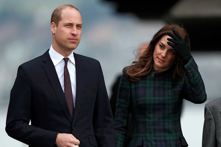 Prince William, Duke of Cambridge and Catherine, Duchess of Cambridge, walk together.