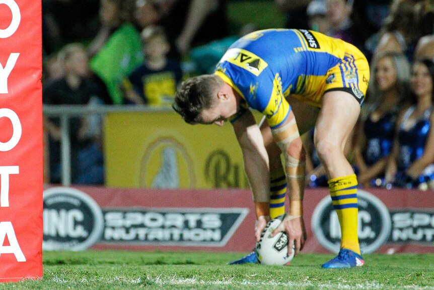 The Eels' Clint Gutherson scores a try during the round nine NRL match against the Cowboys in Townsville on April 28, 2017.
