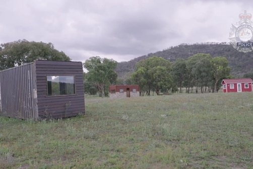 Three cabins on a rural property.