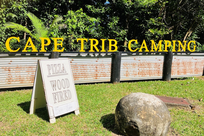 Cape Tribulation camping ground sign at entrance.