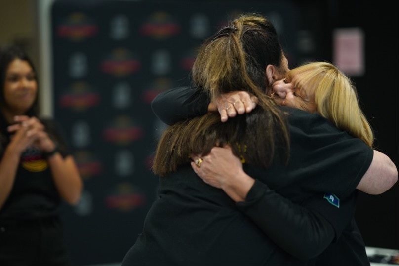 Geraldine Atkinson and Jill Gallagher hug.