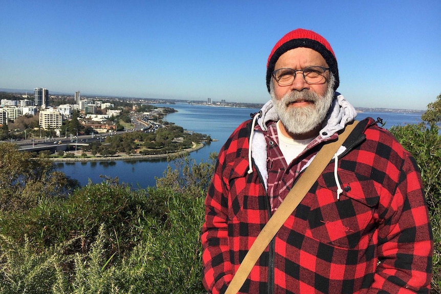 Professor Forrest stands in front of the Swan River.