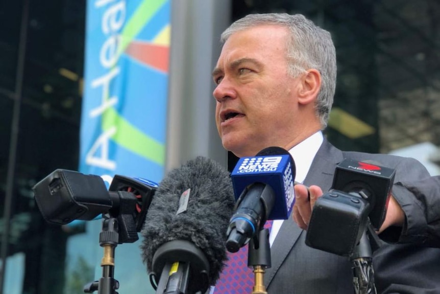 A man speaking at a press conference.