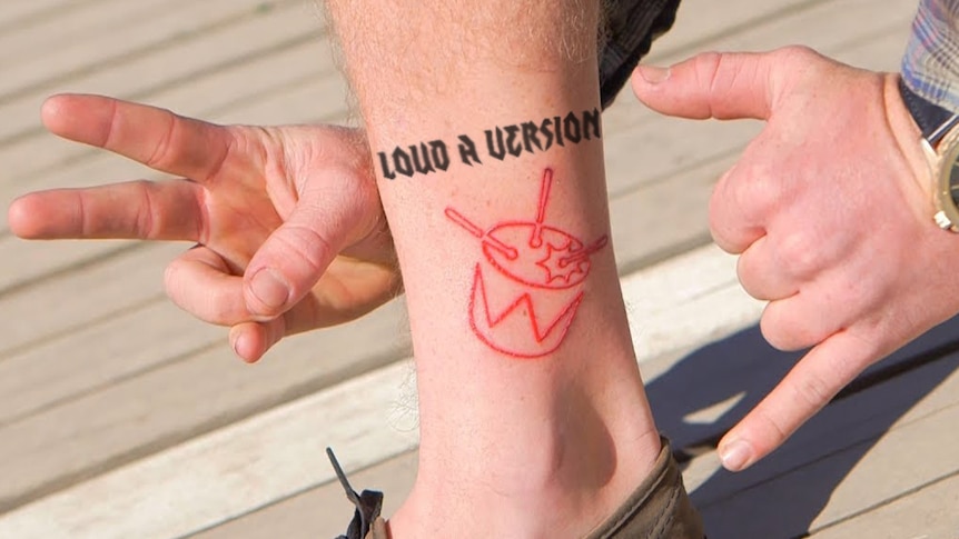 A photoshop of a fake tattoo reading 'LOUD A VERSION' on the leg of a triple j-tatted fan