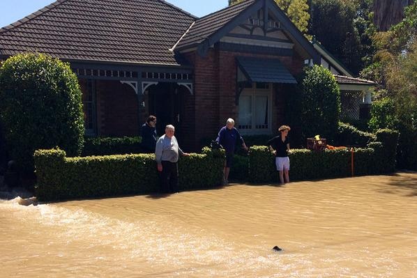Residents watch as water main floods street in Sydney