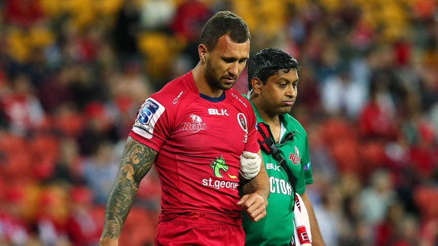 Long recovery ... Quade Cooper leaves the field against the Rebels