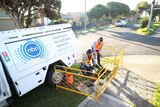 A van and crew roll out the NBN, which has been hit with delays and customer complaints