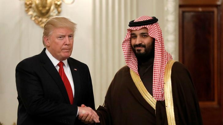 Donald Trump and MbS shake hands