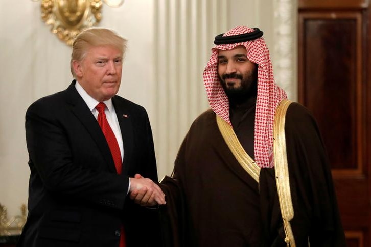 Donald Trump and MbS shake hands