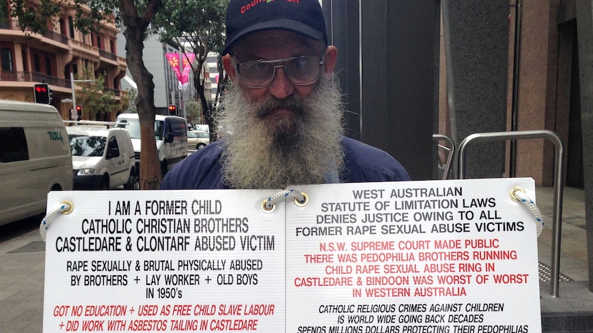 Former abuse victim and protester outside the court