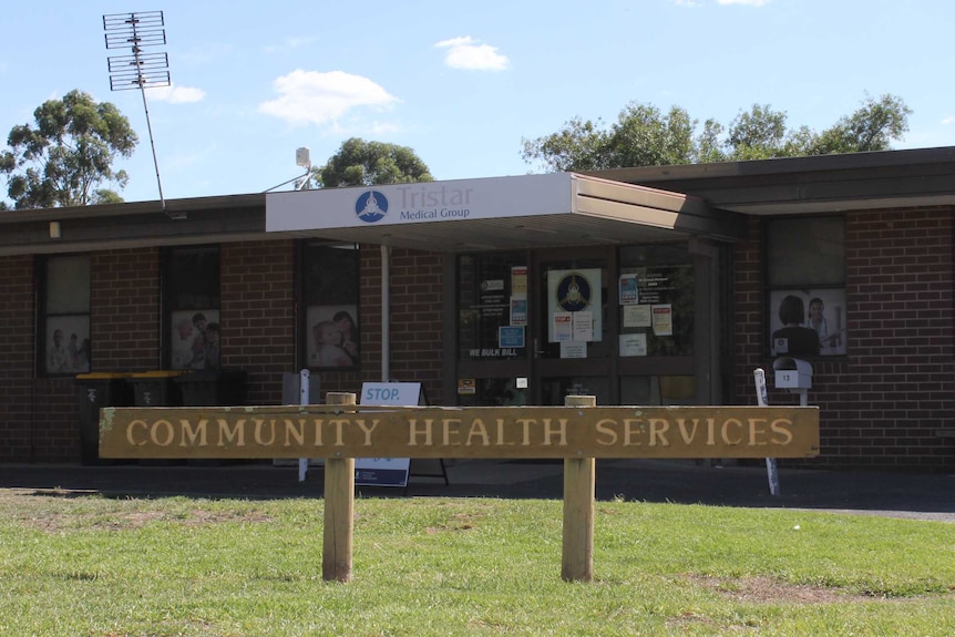 a brick building where the medical centre is based, with a sign that reads community health services in the front