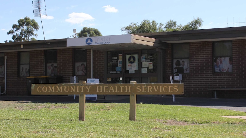 a brick building where the medical centre is based, with a sign that reads community health services in the front