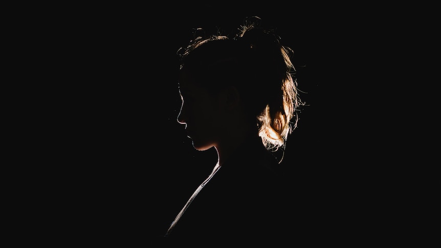 A silhouette of a woman's head and shoulders 