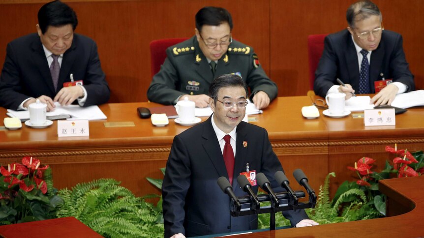 Zhou Qiang, President of China's Supreme People's Court, gives a speech during the third plenary session of the National People's Congress