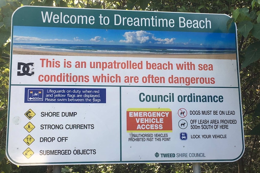 A sign at Dreamtime Beach warns that it is unpatrolled and often has dangerous conditions