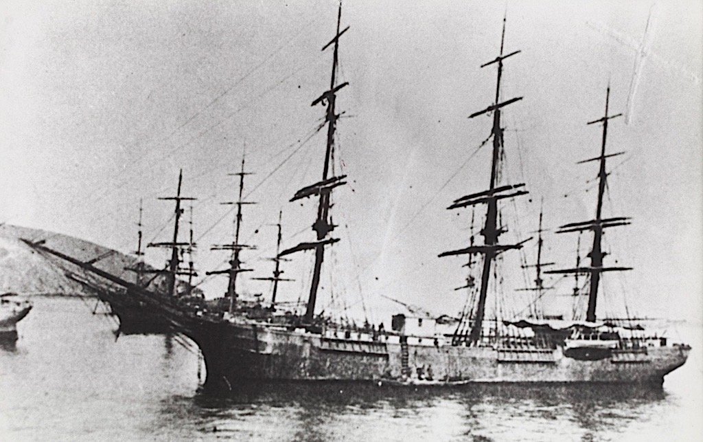 A vintage photograph of a wooden ship in the water 