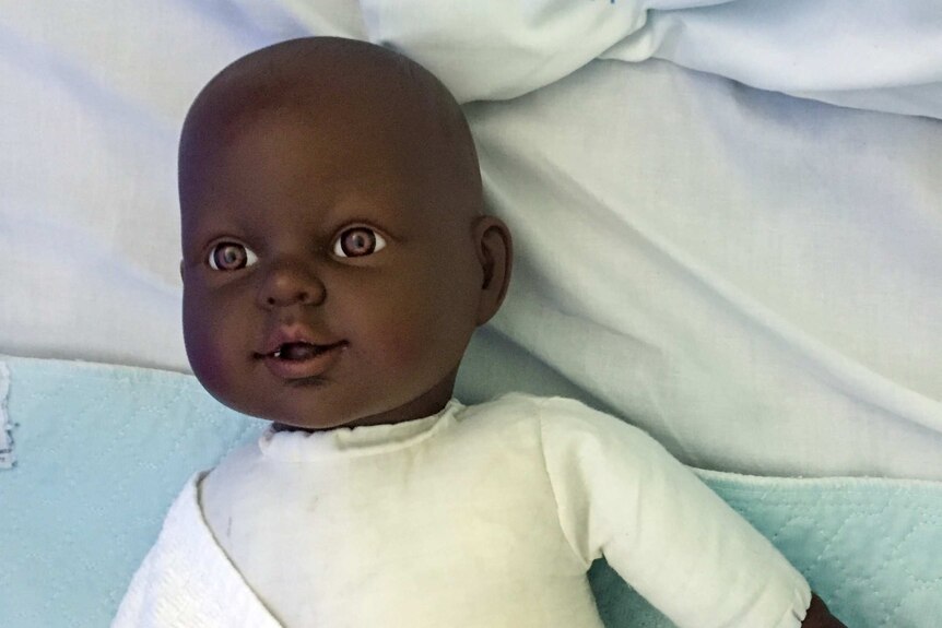 A dark-skinned doll