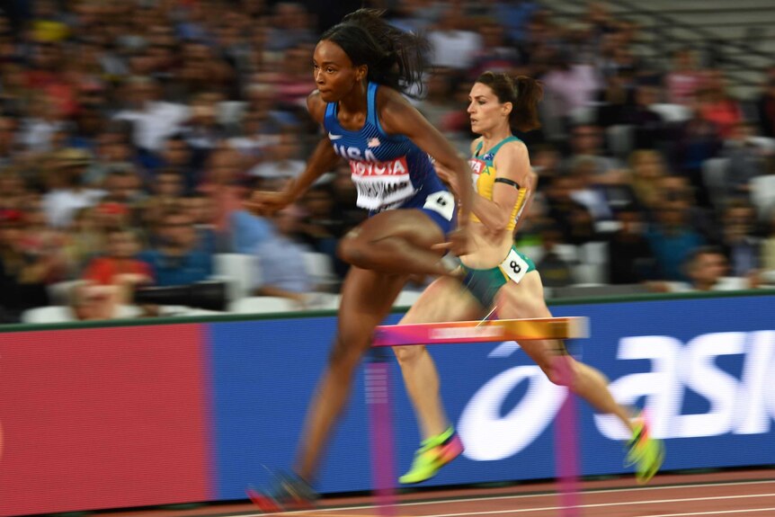 Lauren Wells is seen wearing a black armband during her 400 metres hurdles heat.
