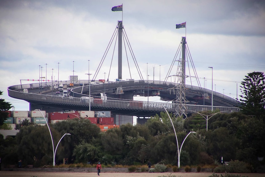 Traffic flows over the curling West Gate Bridge