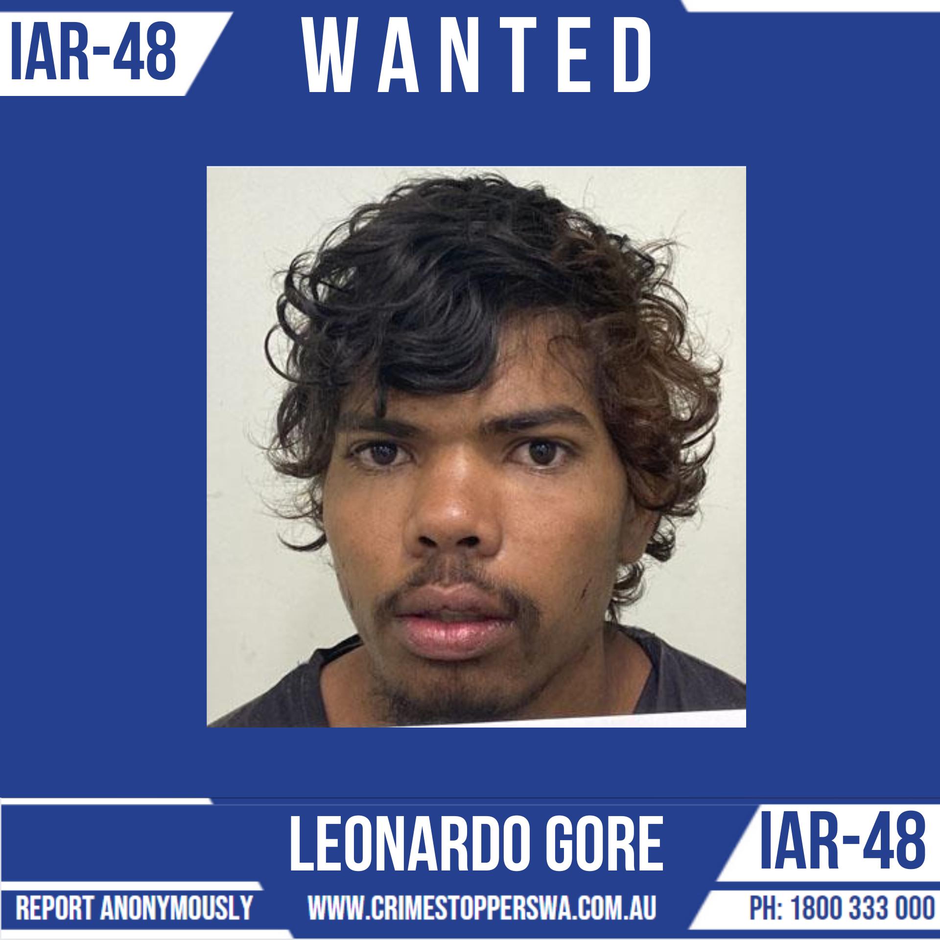 A police mug shot of a young Indigenous man